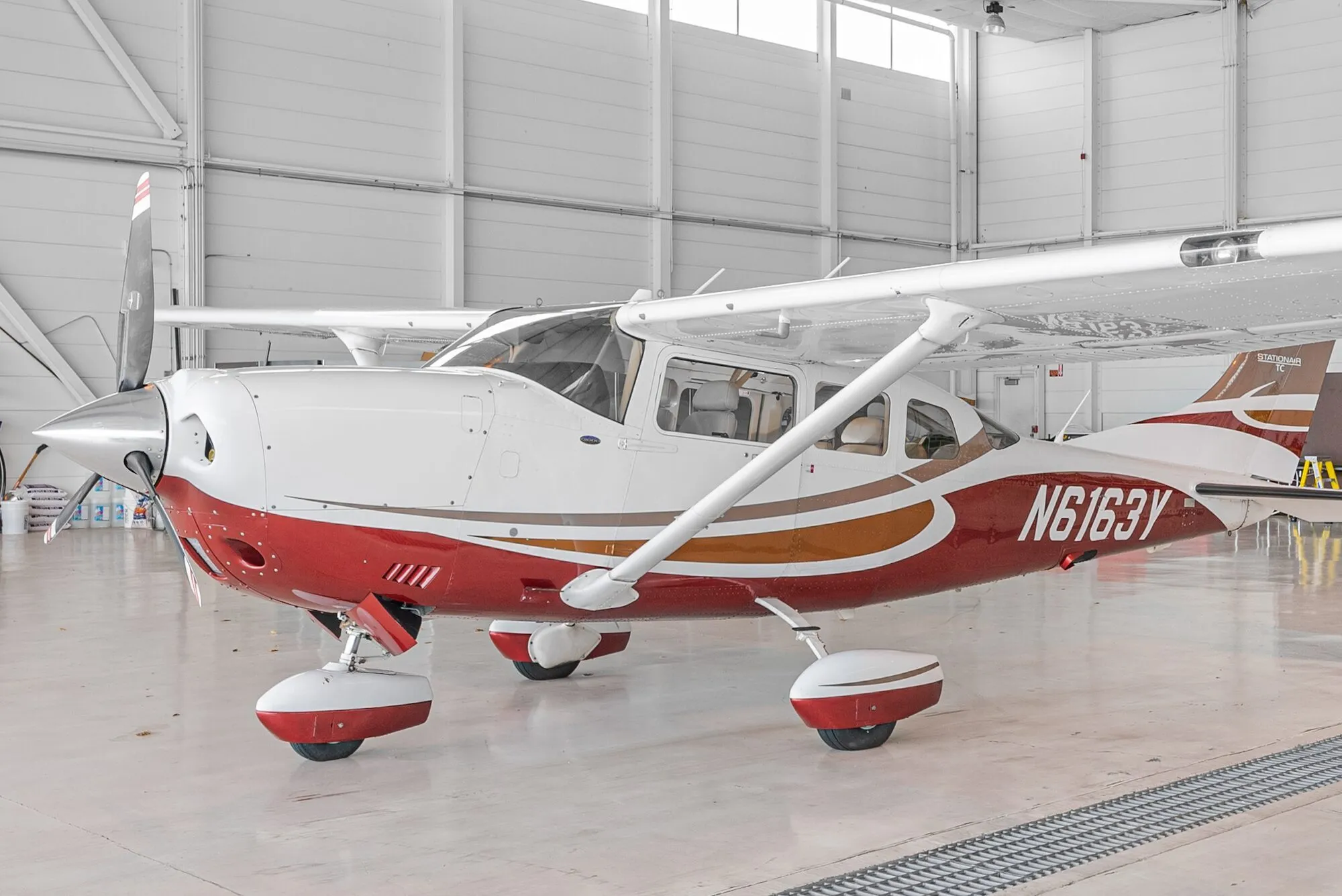 Cessna T206H Turbo Stationair side profile in a hangar