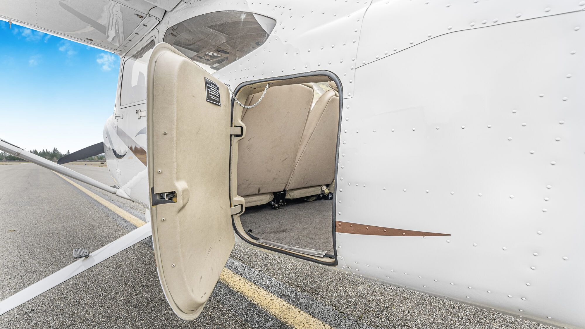Cessna Turbo Skylane baggage door open on the rear fuselage